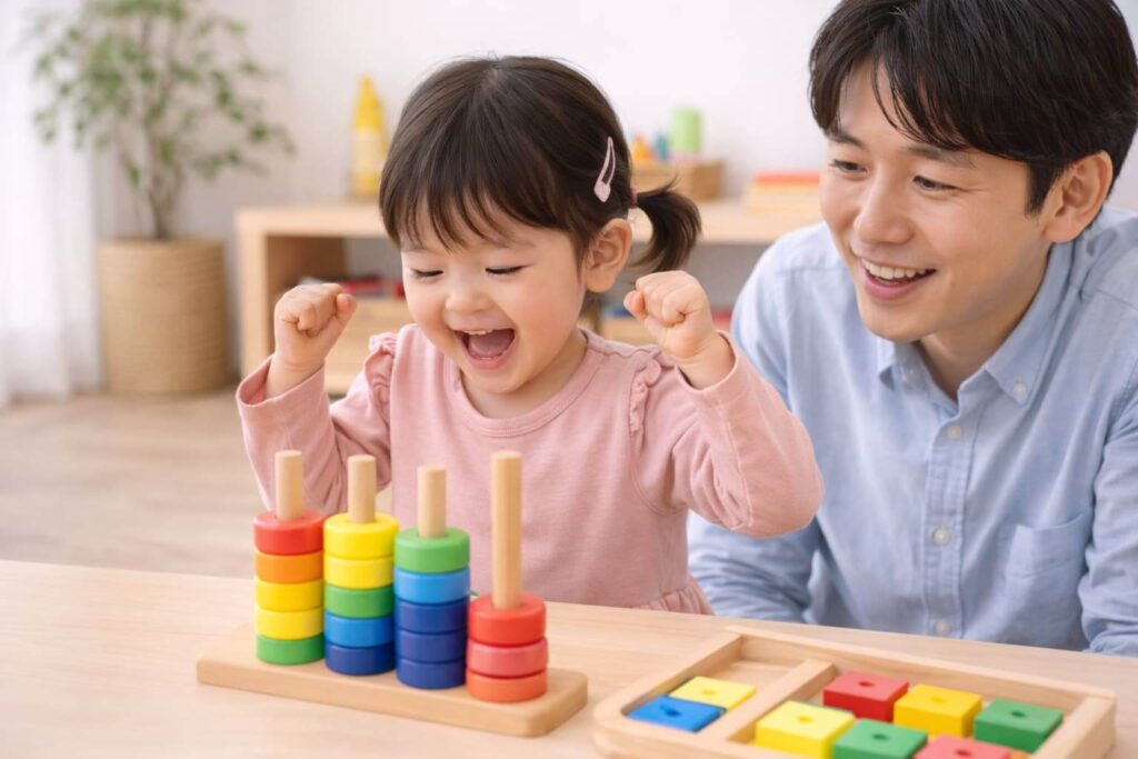 A 4-year-old- Japanese- girl- is- playing -with- an -educational- toy- and- is- happy -about- what- she- has- accomplished. 
