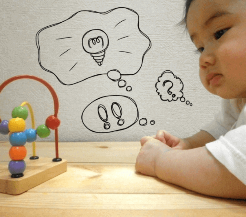 baby- looking -at -educational- toys