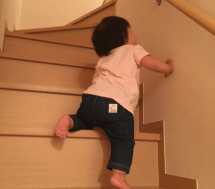 child- climbing- stairs
