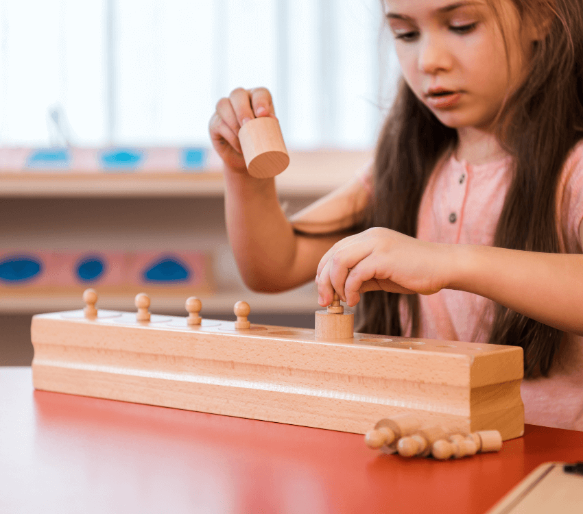 Child -sitting- and -playing -with -educational- toys